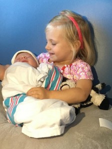Harper holding Olivia